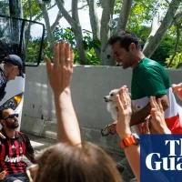 Protesters try to block bus as Iranian women's football team depart Gold Coast hotel – video