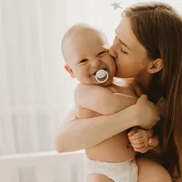 The age you have your first child predicts your long-term educational and financial success